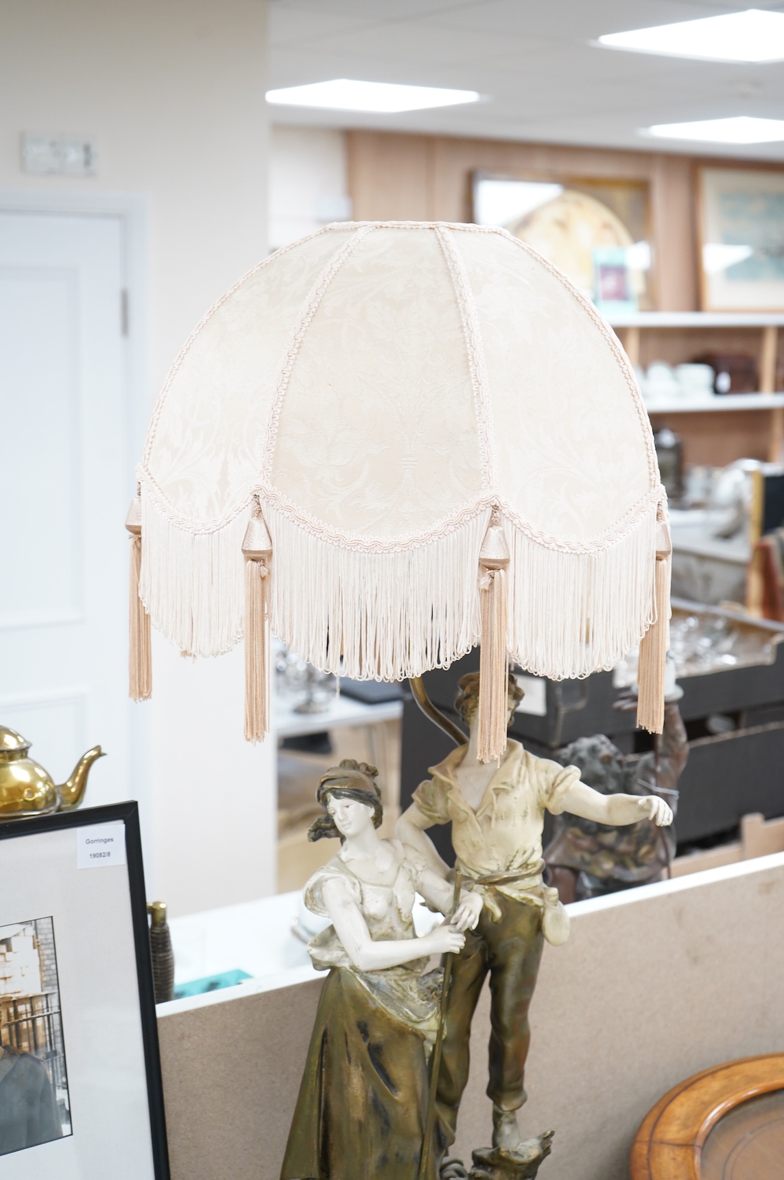 A figural spelter lamp with shade, 90cm high